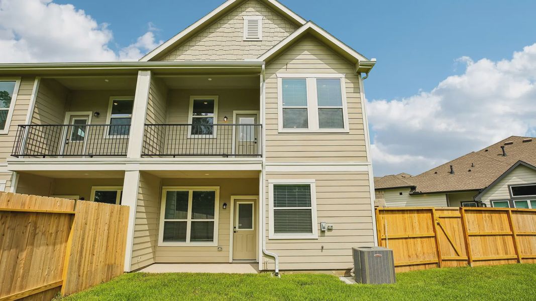 Exterior details and patio area of a home in Woodforest, Montgomery (Image 4).