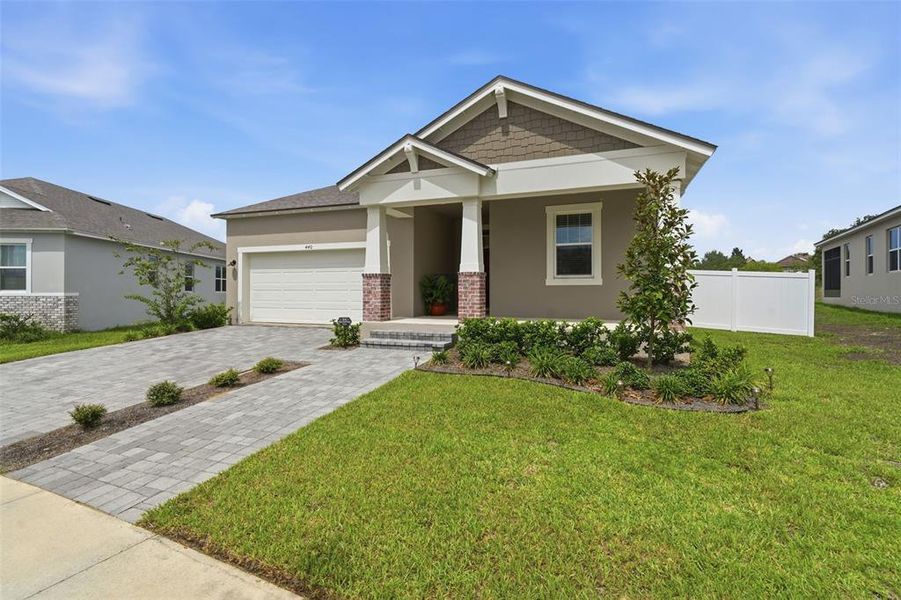 Front exterior of a new home in , Clermont, FL, highlighting curb appeal (Image 24).