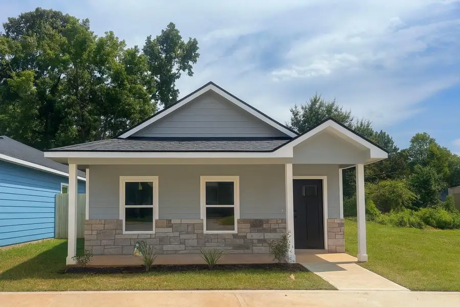 Front exterior of a new home in Lake Conroe Village, Montgomery, TX, highlighting curb appeal (Image 1). Front exterior of a new home in Lake Conroe Village, Montgomery, TX, highlighting curb appeal (Image 1).
