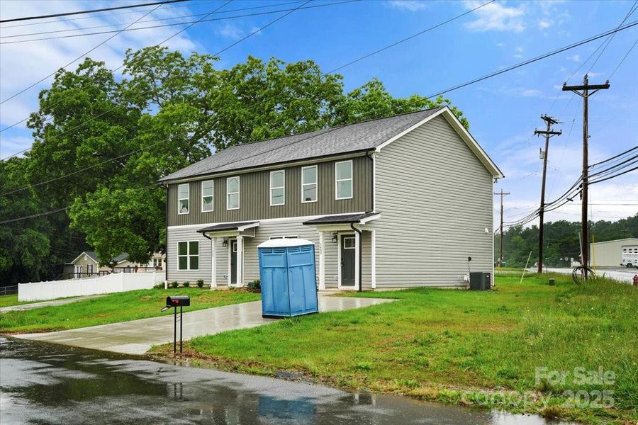 Front exterior of a new home in , Albemarle, NC, highlighting curb appeal (Image 23).