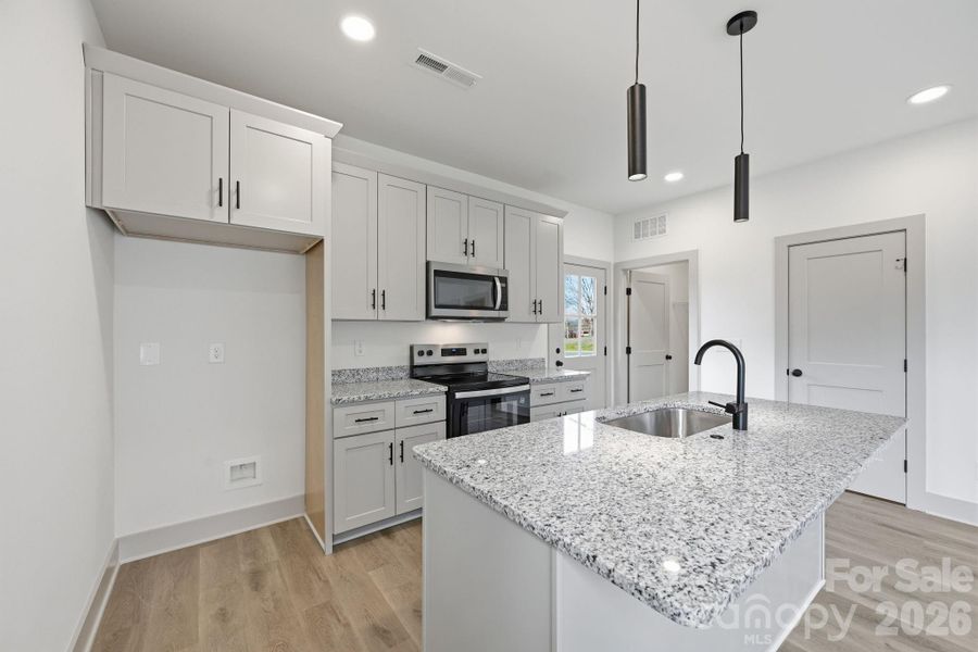 Furnished interior view inside a new home in , Monroe (Image 9).