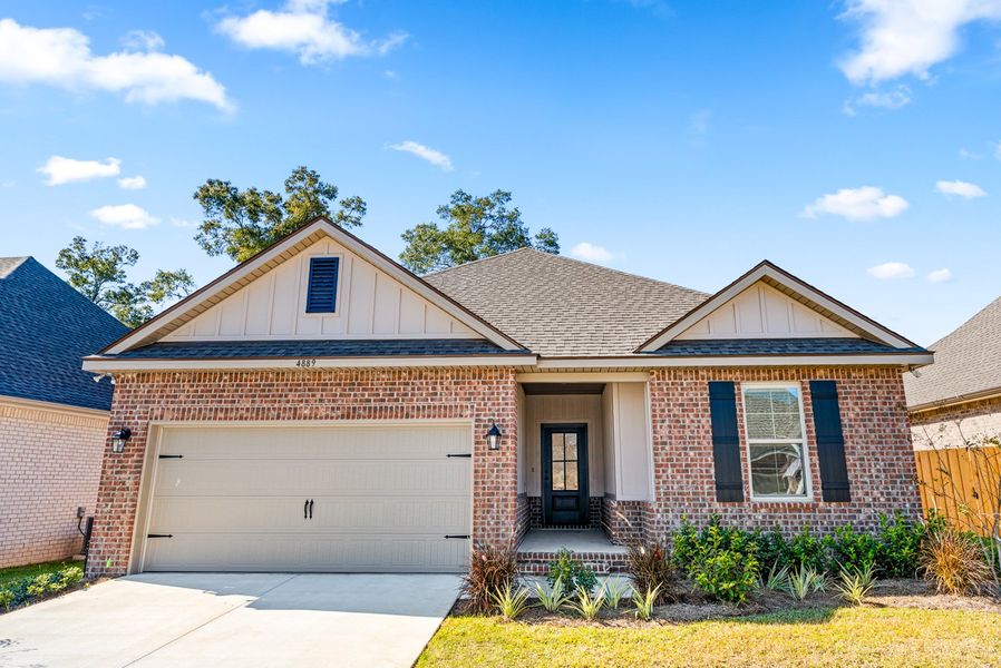 Front exterior of a new home in Sentinel Ridge, Pace, FL, highlighting curb appeal (Image 17).