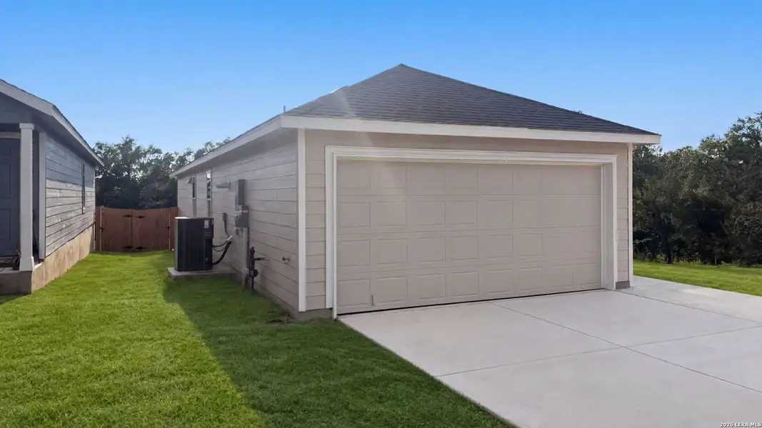 Front exterior of a new home in Landon Ridge, San Antonio, TX, highlighting curb appeal (Image 2). Front exterior of a new home in Landon Ridge, San Antonio, TX, highlighting curb appeal (Image 2).