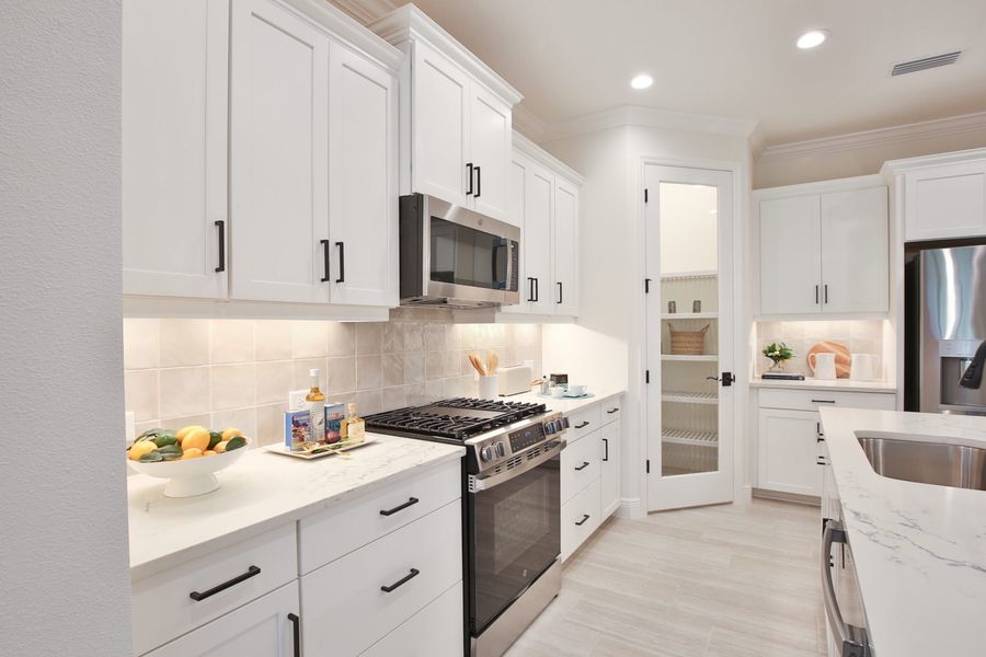 Representative furnished interior of a home built from the Tidewinds 2 by Neal Communities in Boca Royale Golf & Country Club at Wellen Park, Englewood (Image 8).