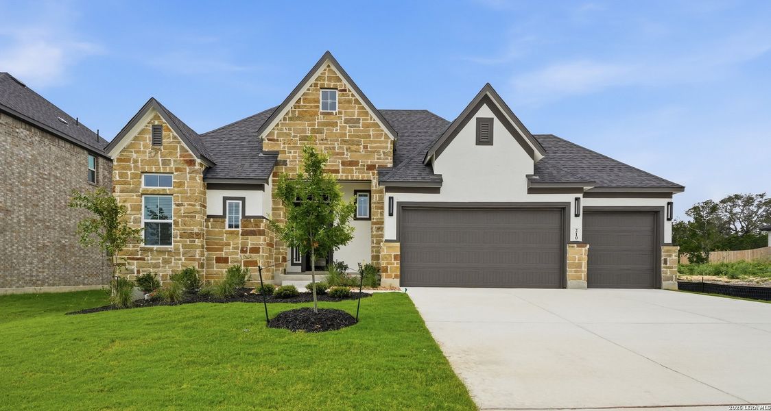 Front exterior of a new home in The Reserve at Potranco Oaks, Castroville, TX, highlighting curb appeal (Image 24).