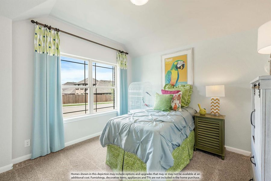 Children's bedroom with vaulted ceiling, large window, blue bedding, and colorful parrot wall art Children's bedroom with vaulted ceiling, large window, blue bedding, and colorful parrot wall art