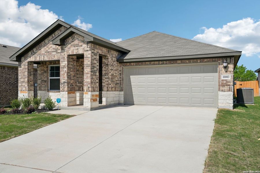 Front exterior of a new home in Sagebrooke - Premier Series, San Antonio, TX, highlighting curb appeal (Image 1). Front exterior of a new home in Sagebrooke - Premier Series, San Antonio, TX, highlighting curb appeal (Image 1).