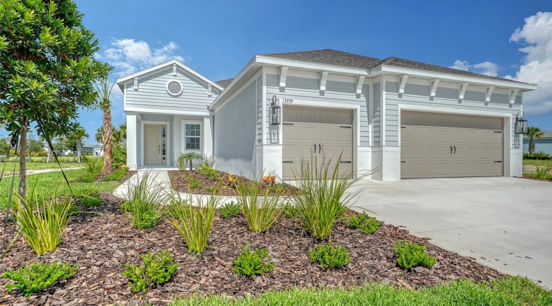 Front exterior of a new home in Canoe Creek, Parrish, FL, highlighting curb appeal (Image 1). Front exterior of a new home in Canoe Creek, Parrish, FL, highlighting curb appeal (Image 1).