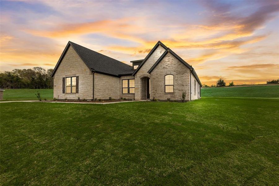Front exterior of a new home in King Crossing Estates, Van Alstyne, TX, highlighting curb appeal (Image 24). Front exterior of a new home in King Crossing Estates, Van Alstyne, TX, highlighting curb appeal (Image 24).
