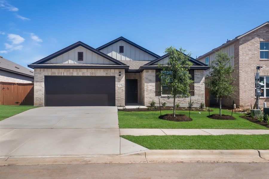 Front exterior of a new home in Oaks at San Gabriel, Georgetown, TX, highlighting curb appeal (Image 19).