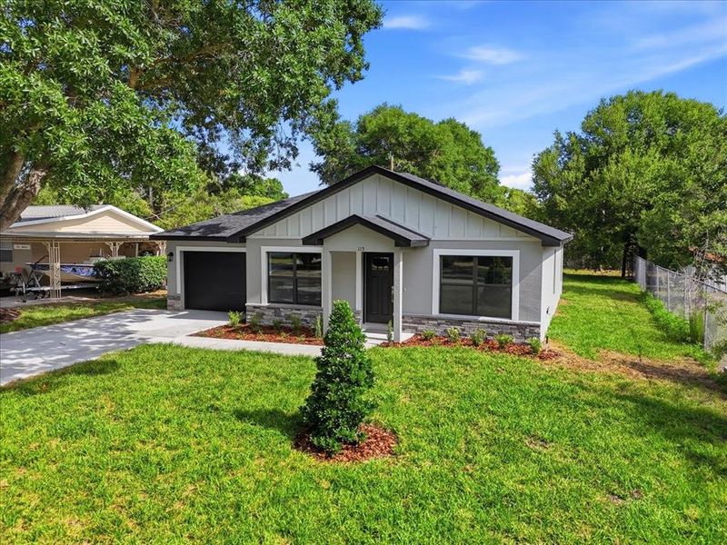 Front exterior of a new home in , Auburndale, FL, highlighting curb appeal (Image 26).