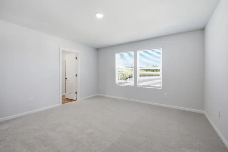 Spacious, unfurnished interior of a new home in Carpenter Falls, Durham (Image 42).