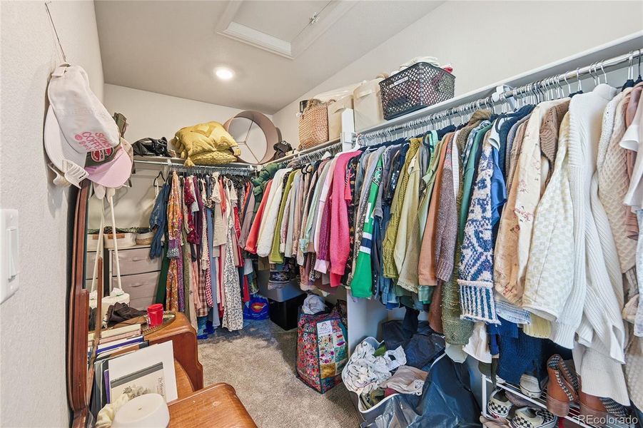 Primary bedroom walk-in closet