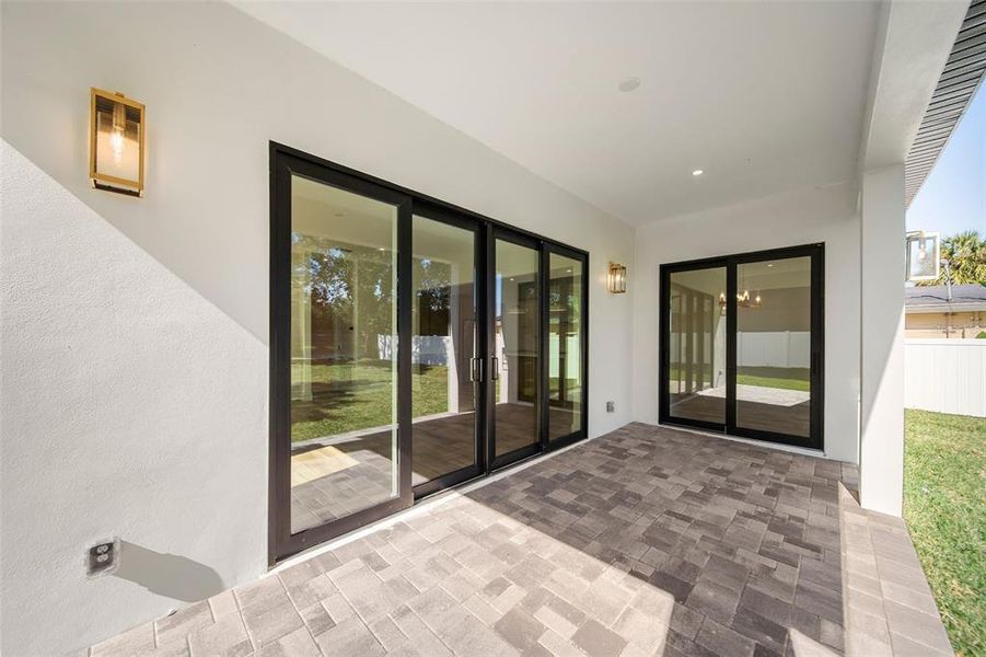 large sliding glass doors opens up to your fenced in backyard