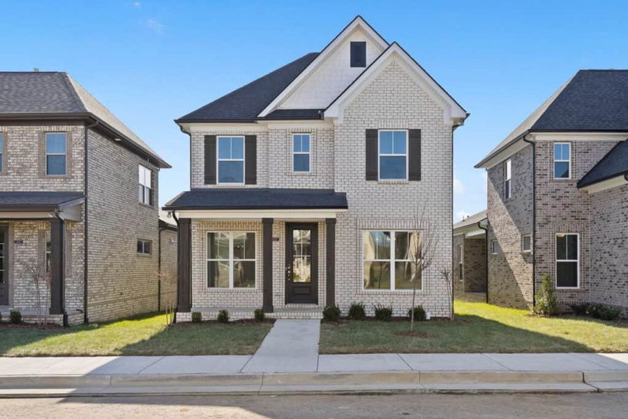 Front exterior of a new home in , Gallatin, TN, highlighting curb appeal (Image 1). Front exterior of a new home in , Gallatin, TN, highlighting curb appeal (Image 1).