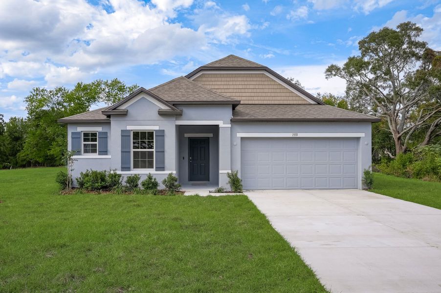 Front exterior of a new home in Enclave At Seminole Palms, Palm Coast, FL, highlighting curb appeal (Image 22).
