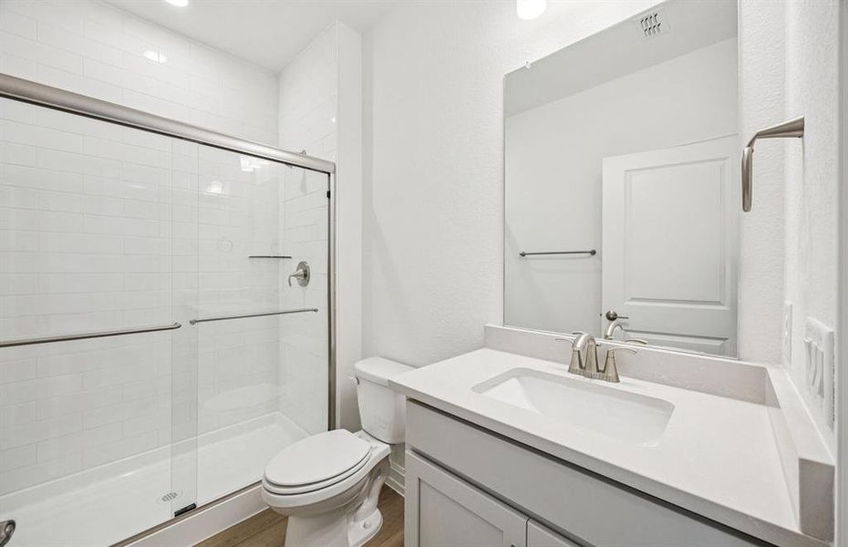 Secondary bath featuring a walk-in shower Secondary bath featuring a walk-in shower