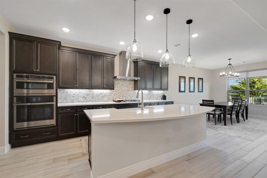 The kitchen is large and shares space with the formal dining room.