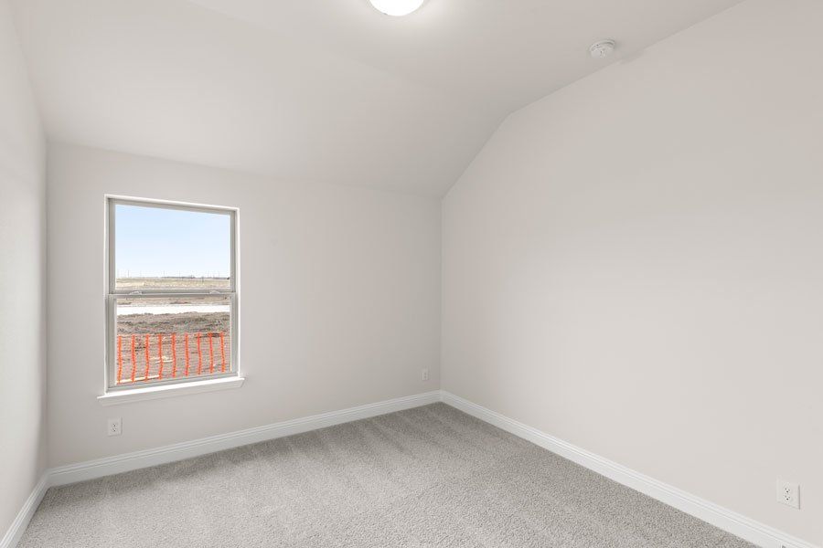 Representative exterior photo of a completed home built from the Kingston by Impression Homes in Timberbrook, Justin, TX (Image 24).