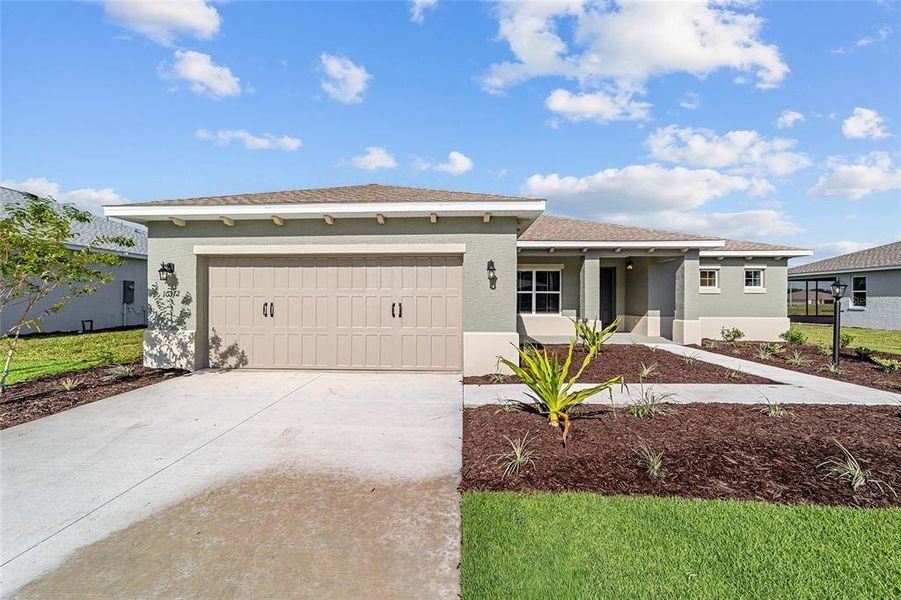 Front exterior of a new home in On Top of the World Communities, Ocala, FL, highlighting curb appeal (Image 2).