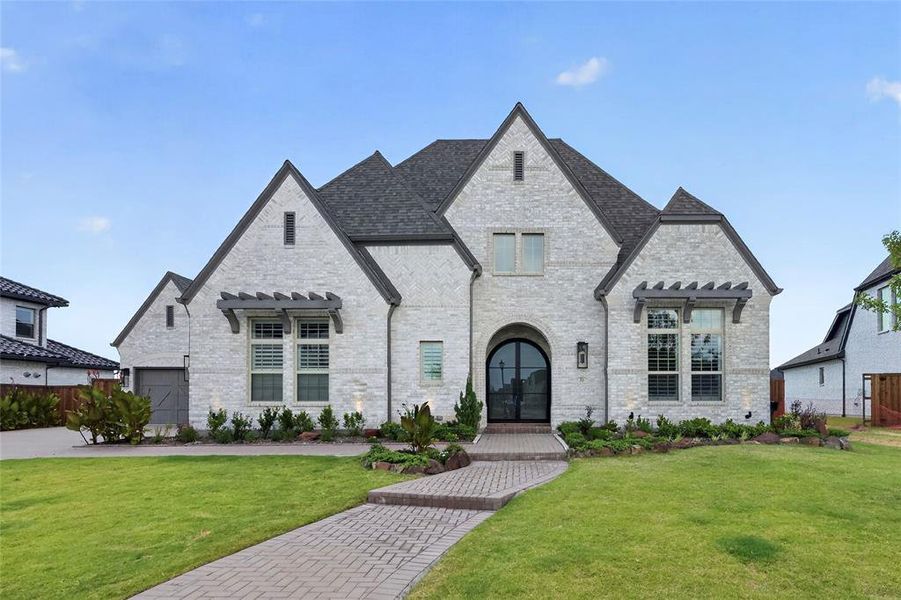 Front exterior of a new home in , Prosper, TX, highlighting curb appeal (Image 1). Front exterior of a new home in , Prosper, TX, highlighting curb appeal (Image 1).