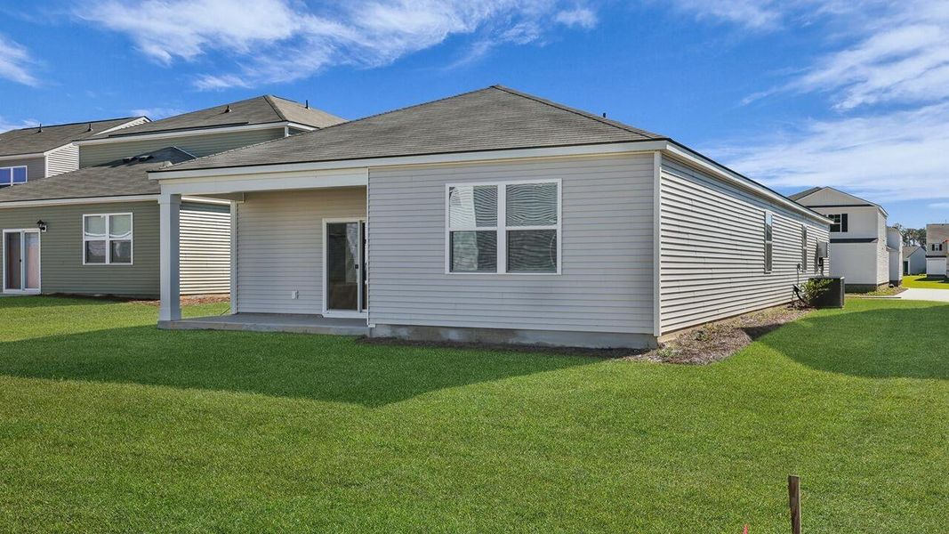Exterior details and patio area of a home in Pine Hills at Cane Bay, Summerville (Image 2).