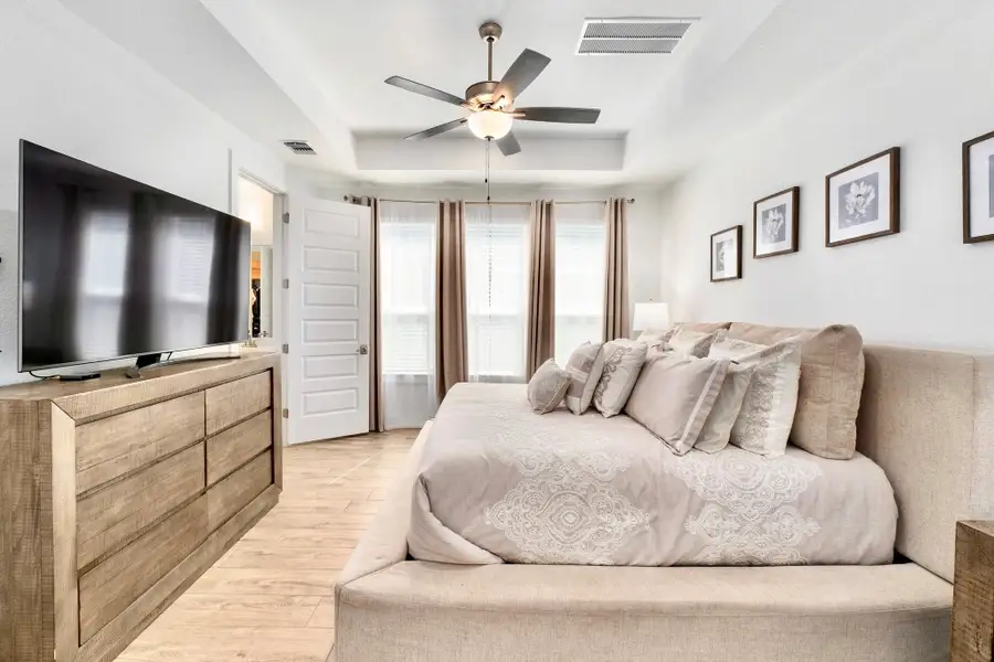 Tons of natural light coming into the primary bedroom.