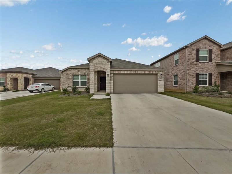 Front exterior of a new home in Townsend Green, Denton, TX, highlighting curb appeal (Image 22).