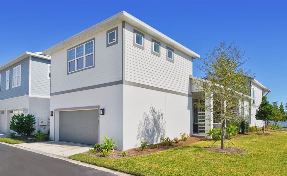 Front exterior of a new home in Laureate Park, Orlando, FL, highlighting curb appeal (Image 22).