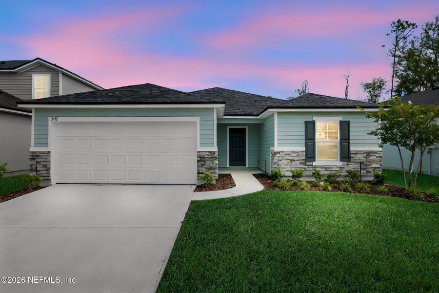 Front exterior of a new home in Wilford Oaks, Orange Park, FL, highlighting curb appeal (Image 20). Front exterior of a new home in Wilford Oaks, Orange Park, FL, highlighting curb appeal (Image 20).