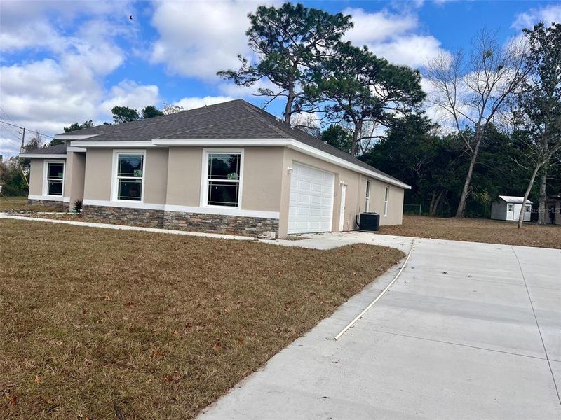 Side entry garage and long driveway.