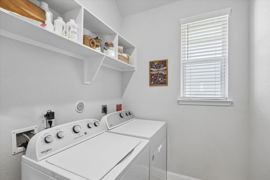 Functional utility/laundry room conveniently located to handle chores with ease. Functional utility/laundry room conveniently located to handle chores with ease.