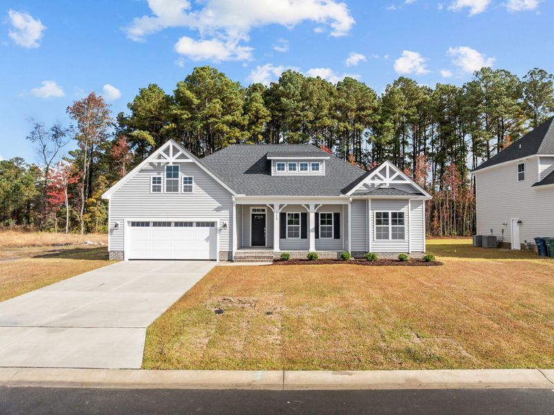 Front exterior of a new home in The Preserve at Langston, Winterville, NC, highlighting curb appeal (Image 22). Front exterior of a new home in The Preserve at Langston, Winterville, NC, highlighting curb appeal (Image 22).