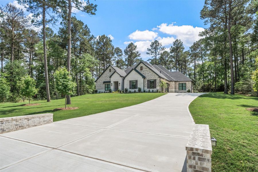 Front exterior of a new home in , Plantersville, TX, highlighting curb appeal (Image 20).