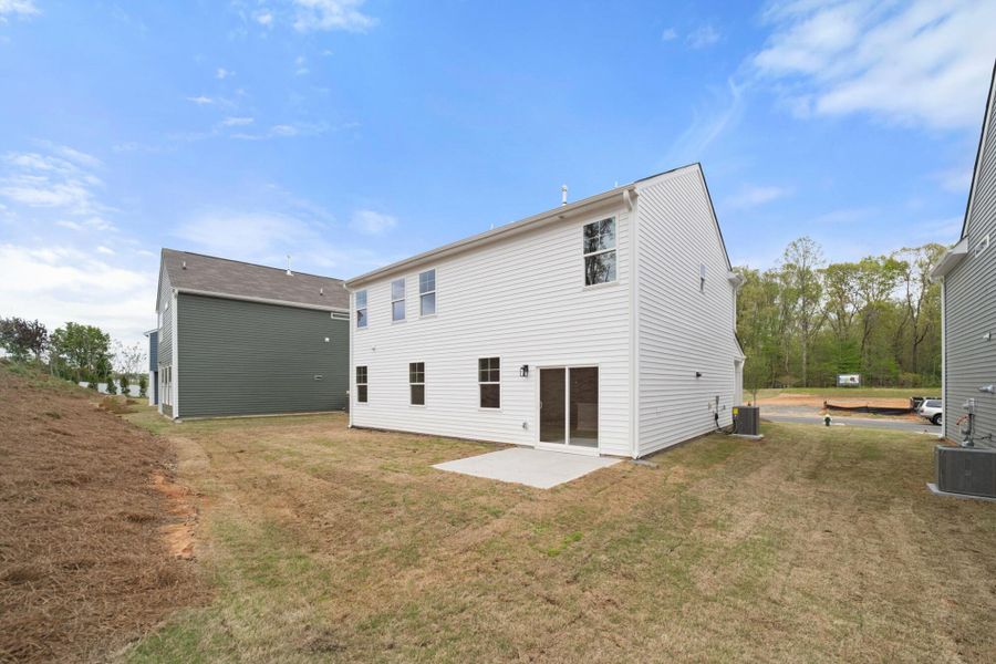 Front exterior of a new home in Chandler Ridge, McLeansville, NC, highlighting curb appeal (Image 18).