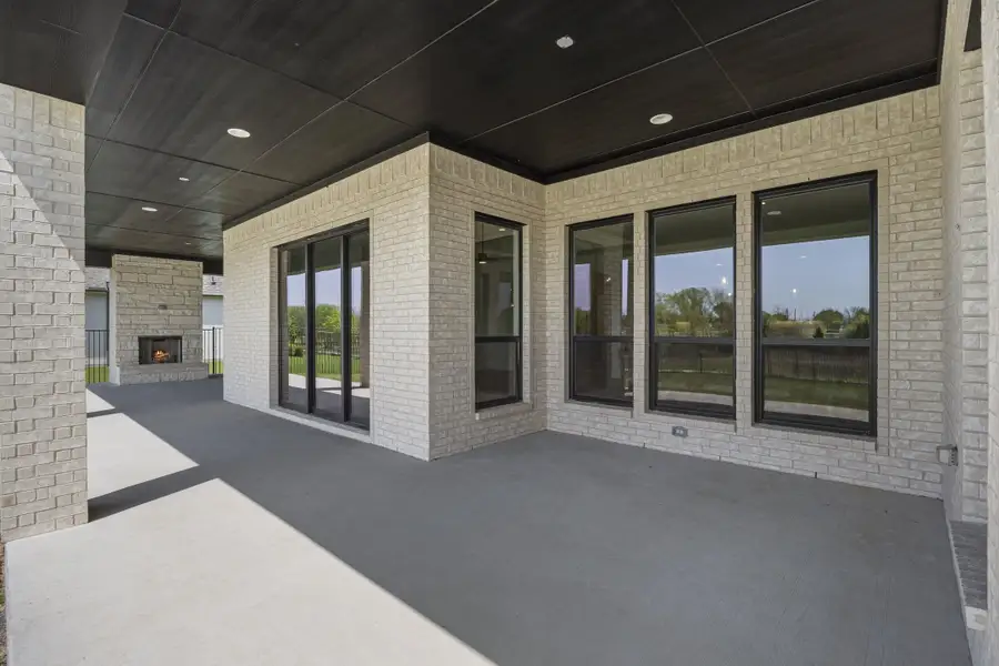 Exterior details and patio area of a home in Winding Creek, Rockwall (Image 3).