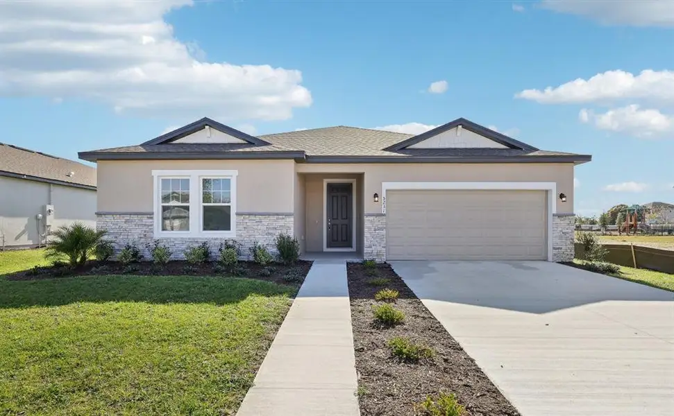 Front exterior of a new home in Tyson Reserve, St. Cloud, FL, highlighting curb appeal (Image 2). Front exterior of a new home in Tyson Reserve, St. Cloud, FL, highlighting curb appeal (Image 2).