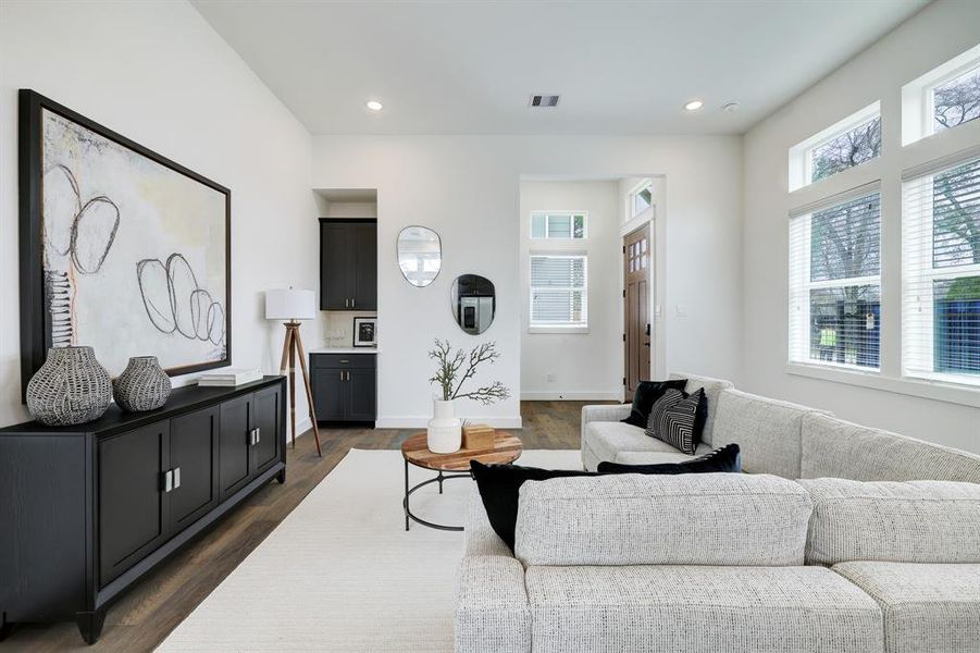 Inviting Living Space: Bright and modern with elegant finishes, this living area exudes comfort and style, featuring large windows for ample natural light and a sophisticated neutral palette.