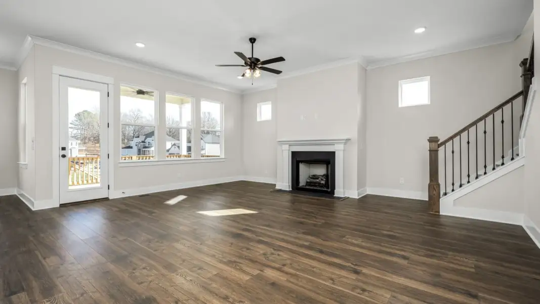 Spacious living area with elevated fireplace feature