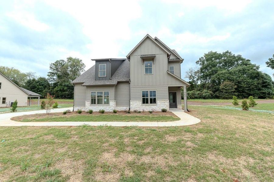 Front exterior of a new home in , Hoschton, GA, highlighting curb appeal (Image 26).