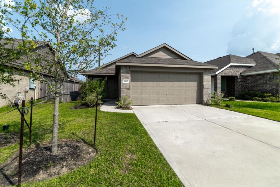 Front exterior of a new home in Burnet Fields at Baytown Crossings, Baytown, TX, highlighting curb appeal (Image 21). Front exterior of a new home in Burnet Fields at Baytown Crossings, Baytown, TX, highlighting curb appeal (Image 21).