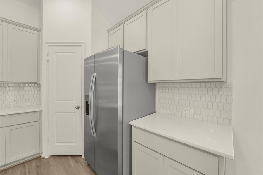 Furnished interior view inside a new home in Bridgeland, Cypress (Image 9).