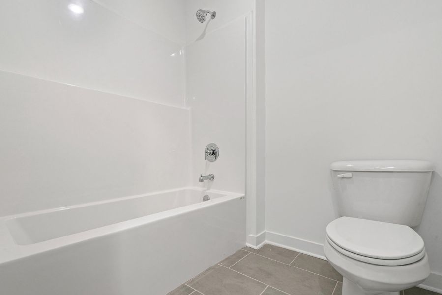 Bathtub and shower combination featuring chrome fixtures