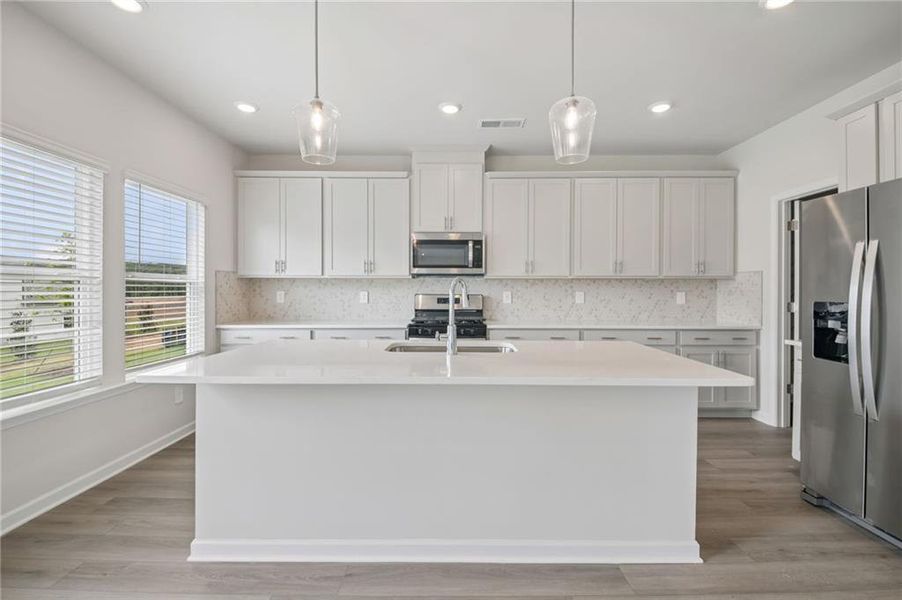 Furnished interior view inside a new home in Northwoods at Mirror Lake, Villa Rica (Image 7).