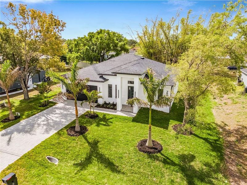 Front exterior of a new home in , Lehigh Acres, FL, highlighting curb appeal (Image 24).