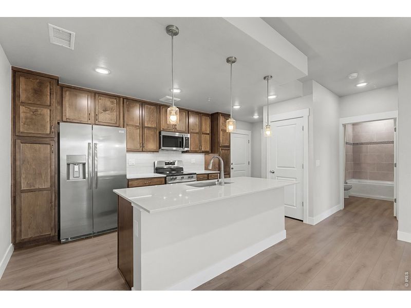Furnished interior view inside a new home in Highlands at Fox Hill - The Flats, Longmont (Image 9).