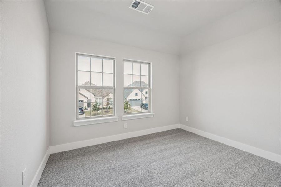 Empty room featuring carpet and baseboards Empty room featuring carpet and baseboards
