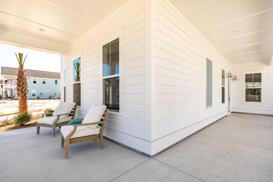 Exterior details and patio area of a home in Heron's Walk at Summers Corner: Row Collection, Summerville (Image 26).