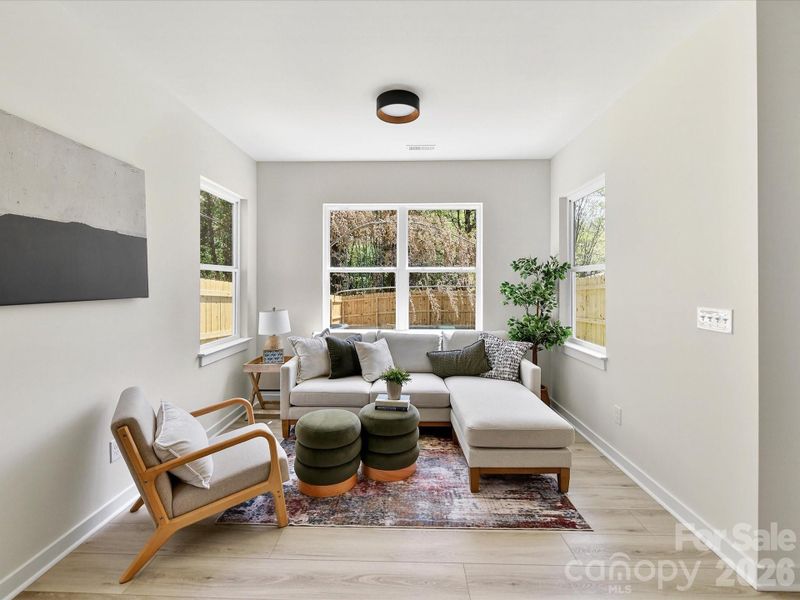 Bright and inviting living room filled with natural light, featuring an open layout and clean, modern finishes perfect for everyday living.