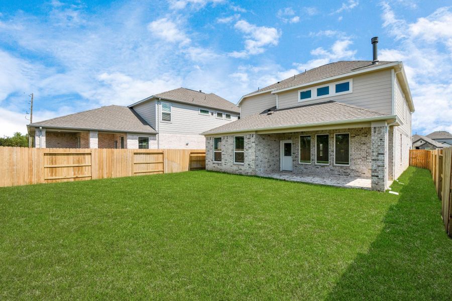 Backyard retreat, offering an abundance of space for kids to play and explore. The possibilities are endless in this outdoor haven, where the joy of open-air activities and family gatherings awaits.